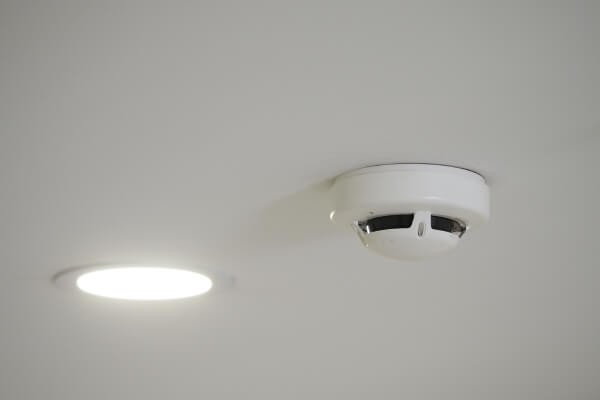smoke detector installed on ceiling in hotel room