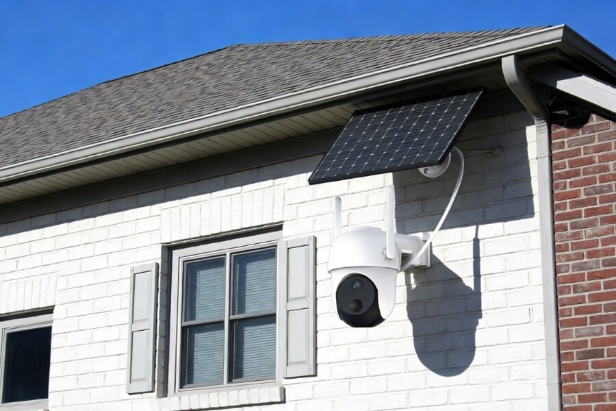 Proper installation of a solar security camera and solar panel on an exterior wall